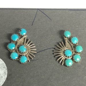 Silver blue green spiral earrings on backing card